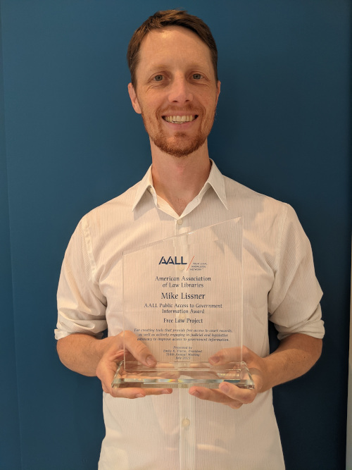 Our director holding the glass award.